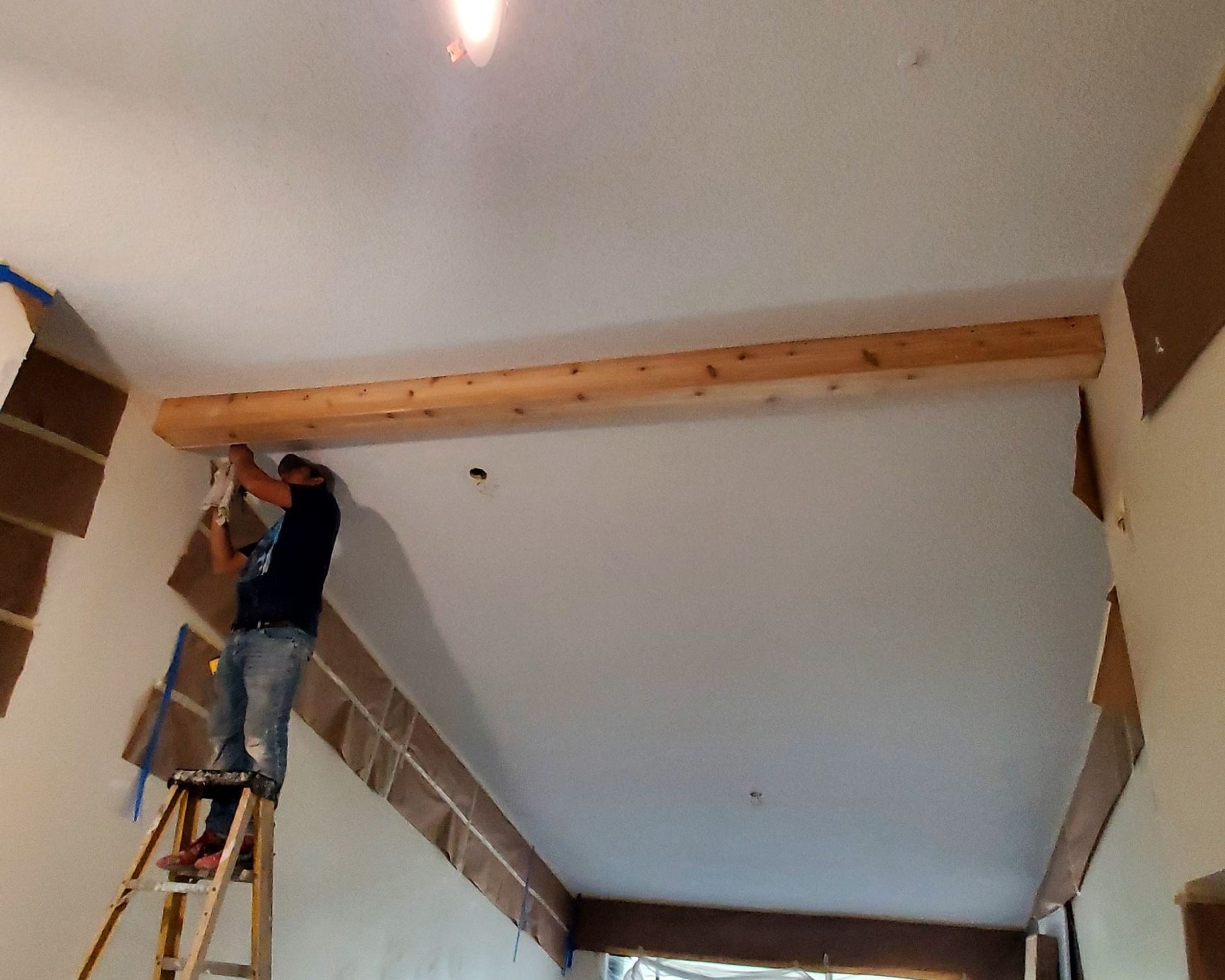Adding this fake cedar boards beam on the ceiling.