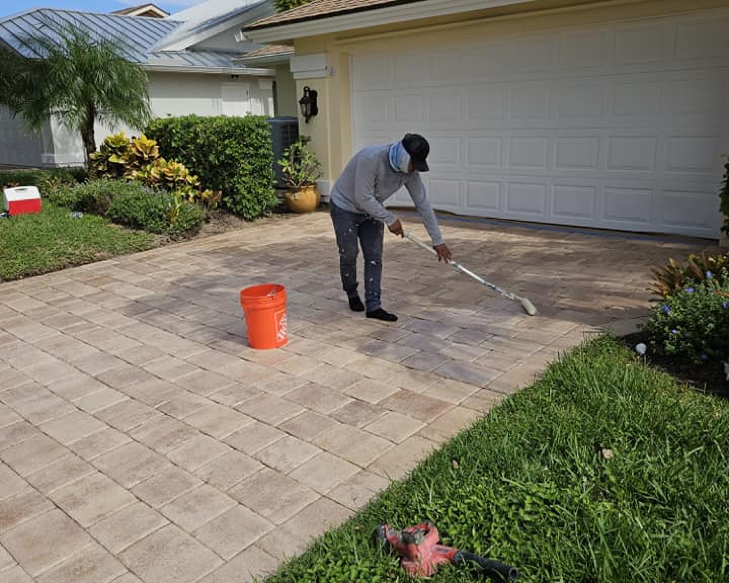 Applying sealer on pavers